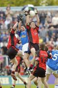 30 May 2004; Dan Gordon, Down, contests a high ball with Rory Donohoe, Cavan, and his team-mate Sean Farrell. Bank of Ireland Ulster Senior Football Championship Replay, Cavan v Down, Kingspan Breffni Park, Co. Cavan. Picture credit; Matt Browne / SPORTSFILE