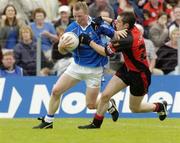 30 May 2004; Jason O'Reilly, Cavan, is tackled by Brendan Grant, Down. Bank of Ireland Ulster Senior Football Championship Replay, Cavan v Down, Kingspan Breffni Park, Co. Cavan. Picture credit; Matt Browne / SPORTSFILE