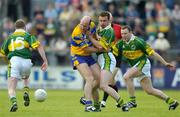 23 May 2004; Donal O'Sullivan, Clare, in action against Mike Frank Russell (15) and William Kirby. Bank of Ireland Munster Senior Football Championship, Clare v Kerry, Cusack Park, Ennis, Co. Clare. Picture credit; Brendan Moran / SPORTSFILE