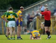 23 May 2004; Referee Gerry Kinneavy signals for medical attention after an accidental clash between himself and Clare's Ger Quinlan (10). Bank of Ireland Munster Senior Football Championship, Clare v Kerry, Cusack Park, Ennis, Co. Clare. Picture credit; Brendan Moran / SPORTSFILE