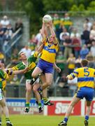 23 May 2004; Donal O'Sullivan, Clare, fields a high ball from Darragh O'Se, left, and William Kirby, Kerry. Bank of Ireland Munster Senior Football Championship, Clare v Kerry, Cusack Park, Ennis, Co. Clare. Picture credit; Brendan Moran / SPORTSFILE