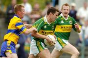 23 May 2004; Eoin Brosnan, Kerry, in action against Ronan Slattery, Clare. Bank of Ireland Munster Senior Football Championship, Clare v Kerry, Cusack Park, Ennis, Co. Clare. Picture credit; Brendan Moran / SPORTSFILE