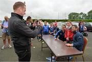 13 August 2013; James Ryan, age 9, from Celbridge, Co. Kildare, poses for a picture with Leinster's Eoin Reddan, left, and Rob Kearney taken by his father John during a Leinster Rugby Summer Camp at Garda RFC, Westmanstown, Co. Dublin. Picture credit: Barry Cregg / SPORTSFILE