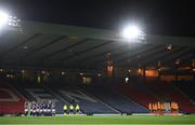 11 October 2022; Players and officials stand for a minutes silence to remember the lives lost and those injured in the Creeslough tragedy in Donegal before the FIFA Women's World Cup 2023 Play-off match between Scotland and Republic of Ireland at Hampden Park in Glasgow, Scotland. Photo by Stephen McCarthy/Sportsfile