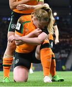 11 October 2022; Amber Barrett of Republic of Ireland, bottom, celebrates with teammates Katie McCabe after scoring their side's first goal by kissing the black armband worn to remember the lives lost and those injured in the Creeslough tragedy in Donegal during the FIFA Women's World Cup 2023 Play-off match between Scotland and Republic of Ireland at Hampden Park in Glasgow, Scotland. Photo by Mick O'Shea/Sportsfile