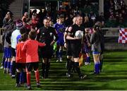 26 October 2022; Referee Damien MacGraith leads players and officials out before during the SSE Airtricity League First Division play-off semi-final first leg match between Treaty United and Waterford at Markets Field in Limerick. Photo by Seb Daly/Sportsfile