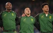 5 November 2022; South Africa players, from left, Makazole Mapimpi, Cheslin Kolbe and Kurt-Lee Arendse during the national anthems before the Bank of Ireland Nations Series match between Ireland and South Africa at the Aviva Stadium in Dublin. Photo by Brendan Moran/Sportsfile