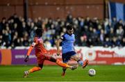 11 November 2022; Evan Osam of UCD in action against Junior Quitirna of Waterford during the SSE Airtricity League Promotion / Relegation Play-off match between UCD and Waterford at Richmond Park in Dublin. Photo by Seb Daly/Sportsfile