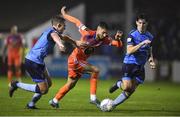 11 November 2022; Yassine En-Neyah of Waterford in action against Evan Caffrey, left, and Dara Keane of UCD during the SSE Airtricity League Promotion / Relegation Play-off match between UCD and Waterford at Richmond Park in Dublin. Photo by Tyler Miller/Sportsfile