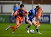 11 November 2022; Michael Gallagher of UCD in action against Phoenix Patterson of Waterford during the SSE Airtricity League Promotion / Relegation Play-off match between UCD and Waterford at Richmond Park in Dublin. Photo by Seb Daly/Sportsfile