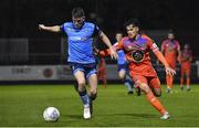 11 November 2022; Michael Gallagher of UCD in action against Phoenix Patterson of Waterford during the SSE Airtricity League Promotion / Relegation Play-off match between UCD and Waterford at Richmond Park in Dublin. Photo by Tyler Miller/Sportsfile