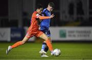 11 November 2022; Michael Gallagher of UCD is tackled by Phoenix Patterson of Waterford during the SSE Airtricity League Promotion / Relegation Play-off match between UCD and Waterford at Richmond Park in Dublin. Photo by Tyler Miller/Sportsfile