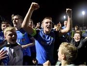 11 November 2022; Jack Keaney of UCD celebrates with supporters after their side's victory in the SSE Airtricity League Promotion / Relegation Play-off match between UCD and Waterford at Richmond Park in Dublin. Photo by Seb Daly/Sportsfile