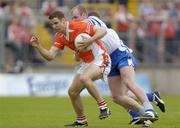 23 May 2004; Paul McGrane, Armagh, in action against Dick Clerkin, Monaghan. Bank of Ireland Ulster Senior Football Championship, Monaghan v Armagh, St. Tighernach's Park, Clones, Co. Monaghan. Picture credit; Damien Eagers / SPORTSFILE