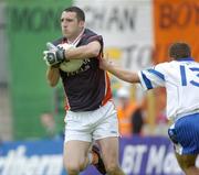 23 May 2004; Paul Hearty, Armagh goalkeeper, in action against Kieran Tavey, Monaghan. Bank of Ireland Ulster Senior Football Championship, Monaghan v Armagh, St. Tighernach's Park, Clones, Co. Monaghan. Picture credit; Damien Eagers / SPORTSFILE