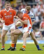 23 May 2004; Philip Loughran, Armagh, in action against Eoin Lennon, Monaghan as teammate Tony McEntee looks on. Bank of Ireland Ulster Senior Football Championship, Monaghan v Armagh, St. Tighernach's Park, Clones, Co. Monaghan. Picture credit; Damien Eagers / SPORTSFILE