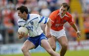 23 May 2004; Gary McQuaid, Monaghan, in action against Paddy McKeever, Armagh. Bank of Ireland Ulster Senior Football Championship, Monaghan v Armagh, St. Tighernach's Park, Clones, Co. Monaghan. Picture credit; Damien Eagers / SPORTSFILE