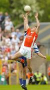 23 May 2004; Paul McGrane, Armagh, contests a high ball with Monaghan's Eoin Lennon. Bank of Ireland Ulster Senior Football Championship, Monaghan v Armagh, St. Tighernach's Park, Clones, Co. Monaghan. Picture credit; Pat Murphy / SPORTSFILE