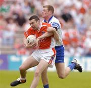 23 May 2004; Martin O'Rourke, Armagh, in action against Eoin Lennon, Monaghan. Bank of Ireland Ulster Senior Football Championship, Monaghan v Armagh, St. Tighernach's Park, Clones, Co. Monaghan. Picture credit; Pat Murphy / SPORTSFILE