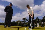 1 June 2004; World leading golf coach Butch Harmon watches over Karl Gilbert, Broomhill Park, Belfast, at the Red Bull masterclass. Portmarnock Golf Club, Portmarnock, Co. Dublin. Picture credit; David Maher / SPORTSFILE