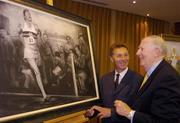 3 June 2004; Former Great Britain athlete Roger Bannister, right, who was the first athlete to break the four minute mile, admires a framed charcoal drawing of the famous moment with former Irish athlete Eamonn Coghlan, at the Westbury Hotel, Dublin. Picture credit; Brian Lawless / SPORTSFILE
