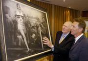 3 June 2004; Former Great Britain athlete Roger Bannister, who was the first athlete to break the four minute mile, admires a framed charcoal drawing of the famous moment with former Irish athlete Eamonn Coghlan, at the Westbury Hotel, Dublin. Picture credit; Brian Lawless / SPORTSFILE