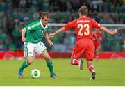 14 August 2013; Niall McGinn, Northern Ireland, in action against Dmitry Kombarov, Russia. 2014 FIFA World Cup Qualifier, Group F, Refixture, Northern Ireland v Russia, Windsor Park, Belfast, Co. Antrim. Picture credit: Liam McBurney / SPORTSFILE