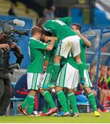 14 August 2013; Martin Paterson, Northern Ireland, is congratulated by team-mates after scoring their side's first goal. 2014 FIFA World Cup Qualifier, Group F, Refixture, Northern Ireland v Russia, Windsor Park, Belfast, Co. Antrim. Picture credit: Liam McBurney / SPORTSFILE