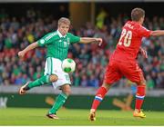14 August 2013; Jamie Ward, Northern Ireland, in action against Viktor Faitzulin, Russia. 2014 FIFA World Cup Qualifier, Group F, Refixture, Northern Ireland v Russia, Windsor Park, Belfast, Co. Antrim. Picture credit: Liam McBurney / SPORTSFILE