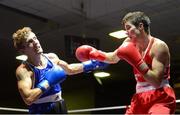 16 August 2013; Eric Donovan, Athy Boxing Club, left, exchanges punches with Declan Geraghty, Crumlin Boxing Club, during their 60kg bout. IABA Elite Boxing Competition, National Stadium, Dublin. Photo by Sportsfile