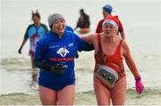 10 December 2022; People get freezin’ for a reason to support Special Olympics Ireland as the organisation raises funds to send over 70 athletes to the World Games in Berlin 2023. Volunteers during the Special Olympics Ireland Polar Plunge at Clogherhead Beach in Louth. Photo by Ramsey Cardy/Sportsfile