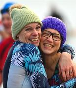 10 December 2022; People get freezin’ for a reason to support Special Olympics Ireland as the organisation raises funds to send over 70 athletes to the World Games in Berlin 2023. Faye McClory, left, and Monika Kobylarska during the Special Olympics Ireland Polar Plunge at Clogherhead Beach in Louth. Photo by Ramsey Cardy/Sportsfile