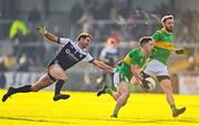 11 December 2022; Conleth McGuckian of Glen in action against Niall Branagan of Kilcoo during the AIB Ulster GAA Football Senior Club Championship Final match between Glen Watty Graham's of Derry and Kilcoo of Down at the Athletics Grounds in Armagh. Photo by Ben McShane/Sportsfile