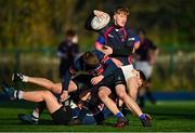 15 December 2022; Zach Maginness of Mountrath is tackled by St. Colmcilles defence during the Bank of Ireland Leinster Rugby Division 3A JCT Development Shield match between Mountrath School and St. Colmcilles Community School at Energia Park in Dublin. Photo by Ben McShane/Sportsfile