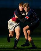 15 December 2022; Zach Maginness of Mountrath is tackled by Quin Monson of St Colmcilles during the Bank of Ireland Leinster Rugby Division 3A JCT Development Shield match between Mountrath School and St. Colmcilles Community School at Energia Park in Dublin. Photo by Ben McShane/Sportsfile
