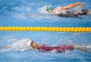 16 December 2022; Naroa Sanz of Longford SC, bottom, and Antonina Sech of Sundays Well SC compete in the heats of the Women's 100m backstroke during day two of the Irish National Winter Swimming Championships 2022 at the National Aquatic Centre, on the Sport Ireland Campus, in Dublin. Photo by David Fitzgerald/Sportsfile