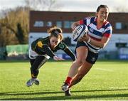 17 December 2022; Maeve Liston of Blackrock College evades the tackle of Railway Union's Molly Scuffil McCabe on her way to scoring her side's first try during the Energia AIL Women's Division Final match between Blackrock College and Railway Union at Energia Park in Dublin. Photo by Seb Daly/Sportsfile