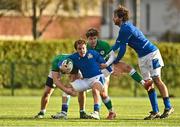 17 December 2022; Tommaso Simoni of Italy, supported by Alex Mattioli, is tackled by Gus McCarthy, left, and Matthew Lynch of Ireland during the U20 Rugby International Friendly match between Ireland and Italy at Clontarf RFC in Dublin. Photo by Sam Barnes/Sportsfile