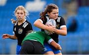 3 January 2023; Millie Merrigan-Devlin of Metro is tackled by Niamh Murphy of North Midlands during the Leinster Rugby Bank of Ireland Sarah Robinson Cup Round Four match between Metro and North Midlands at Energia Park in Dublin. Photo by Ramsey Cardy/Sportsfile