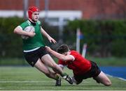 4 January 2023; Finn Soraine of South East is tackled by Ben O'Hare of North East during the Shane Horgan Cup Round Three match between South East and North East at Clontarf RFC in Dublin. Photo by Harry Murphy/Sportsfile