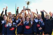 7 January 2023; Portlaoise RFC captain Elisha Gilligan lifts the cup as her team-mates celebrate after the Bank of Ireland Leinster Rugby Girls U14 Cup match between Portlaoise RFC of Laois and Greystones RFC of Wicklow at the Pitch 1 in SETU Carlow, Carlow. Photo by Matt Browne/Sportsfile