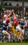 22 January 2023; Cork players Declan Dalton and Colin Walsh and Tipperary players Michael Breen and Pauric Campion challenge for the sliotar during the Co-Op Superstores Munster Hurling League Final match between Cork and Tipperary at Páirc Ui Rinn in Cork. Photo by Seb Daly/Sportsfile