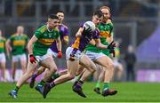 22 January 2023; Micheál Mullin of Kilmacud Crokes in action against Danny Tallon, left, and Conor Glass of Watty Graham's Glen during the AIB GAA Football All-Ireland Senior Club Championship Final match between Watty Graham's Glen of Derry and Kilmacud Crokes of Dublin at Croke Park in Dublin. Photo by Ramsey Cardy/Sportsfile