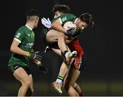 25 January 2023; Fintan Canavan of Queen's University Belfast in action against Shane Merritt of UCC during the HE GAA Sigerson Cup Round 3 match between University College Cork and Queen's University Belfast at the GAA National Games Development Centre in Abbotstown, Dublin. Photo by Piaras Ó Mídheach/Sportsfile