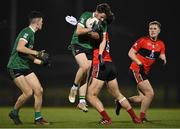 25 January 2023; Fintan Canavan of Queen's University Belfast in action against Shane Merritt of UCC during the HE GAA Sigerson Cup Round 3 match between University College Cork and Queen's University Belfast at the GAA National Games Development Centre in Abbotstown, Dublin. Photo by Piaras Ó Mídheach/Sportsfile