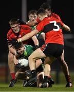 25 January 2023; Luke Donnelly of Queen's University Belfast in action against UCC players, from left, Jack Murphy, Briain Murphy and Daniel O'Mahony, 3, during the HE GAA Sigerson Cup Round 3 match between University College Cork and Queen's University Belfast at the GAA National Games Development Centre in Abbotstown, Dublin. Photo by Piaras Ó Mídheach/Sportsfile