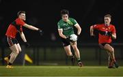 25 January 2023; Patrick Finnegan of Queen's University Belfast in action against Bill Curtin, left, and Jack Murphy of UCC during the HE GAA Sigerson Cup Round 3 match between University College Cork and Queen's University Belfast at the GAA National Games Development Centre in Abbotstown, Dublin. Photo by Piaras Ó Mídheach/Sportsfile