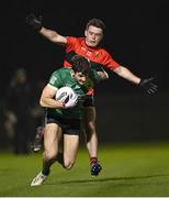 25 January 2023; Dan Higgins of Queen's University Belfast in action against Killian Flavey of UCC during the HE GAA Sigerson Cup Round 3 match between University College Cork and Queen's University Belfast at the GAA National Games Development Centre in Abbotstown, Dublin. Photo by Piaras Ó Mídheach/Sportsfile