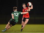 25 January 2023; Dylan Geaney of UCC in action against Kealan Friel of Queen's University Belfast during the HE GAA Sigerson Cup Round 3 match between University College Cork and Queen's University Belfast at the GAA National Games Development Centre in Abbotstown, Dublin. Photo by Piaras Ó Mídheach/Sportsfile