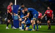 28 January 2023; Luke McGrath of Leinster celebrates with team-mates Michael Ala'alatoa, John McKee and Ross Molony after scoring his second and their side's third try during the United Rugby Championship match between Leinster and Cardiff at RDS Arena in Dublin. Photo by Brendan Moran/Sportsfile